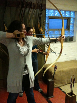 Kim tries archery