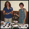 Tracy and Sue serving cake at the reception