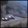 The cars driving next to the cliff to Positano
