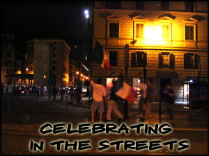 People celebrating in the streets near the shelter